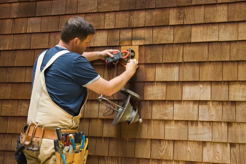 Electrician Installing Light Fixture